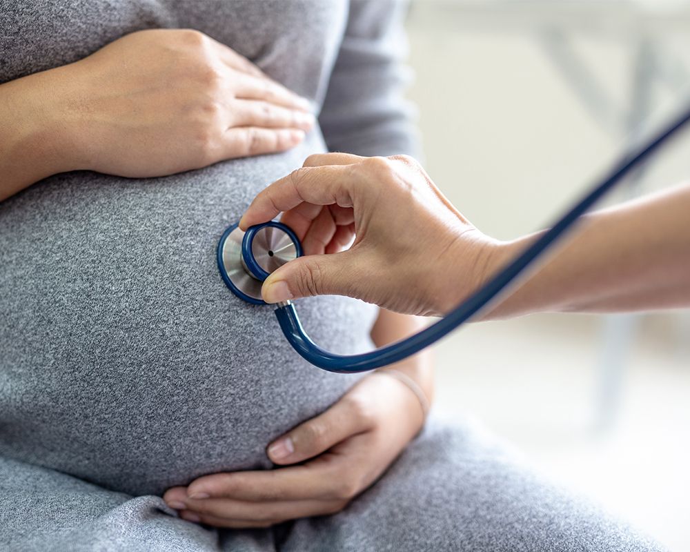 Pregnant Woman is Being Examined by a Doctor
