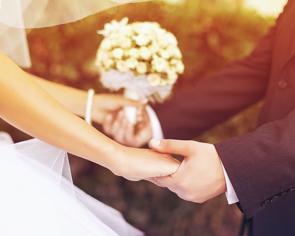 Bride and Groom are Holding Hands