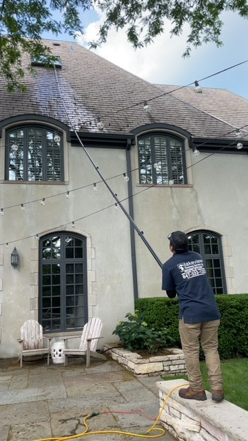 Cleaning gutters with pole. Cleaning gutters with pole.