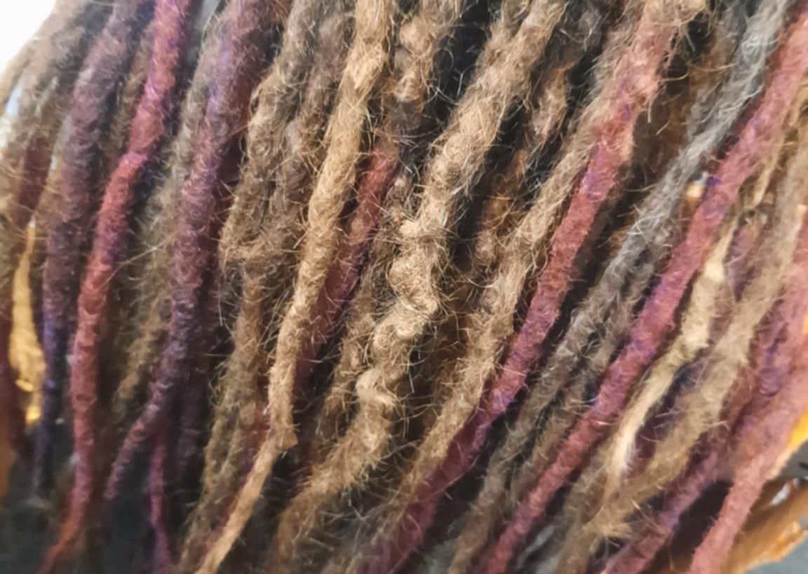 multi coloured natural dreads, kinks, elbows and organic shape