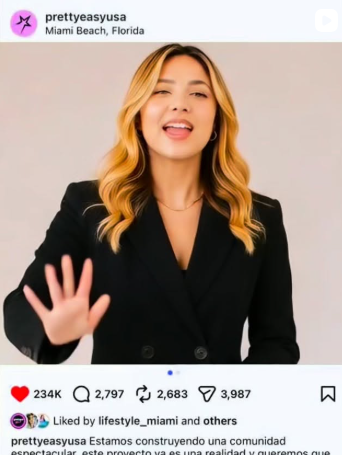 Woman with blonde hair in a black blazer smiling and waving on a social media post screenshot