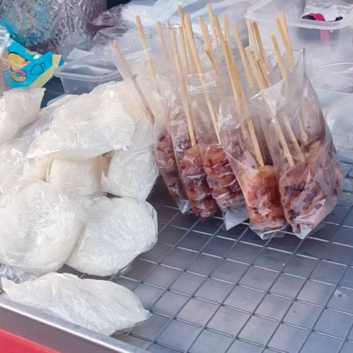 Moo Ping grilled pork skewers with sticky rice in Thailand