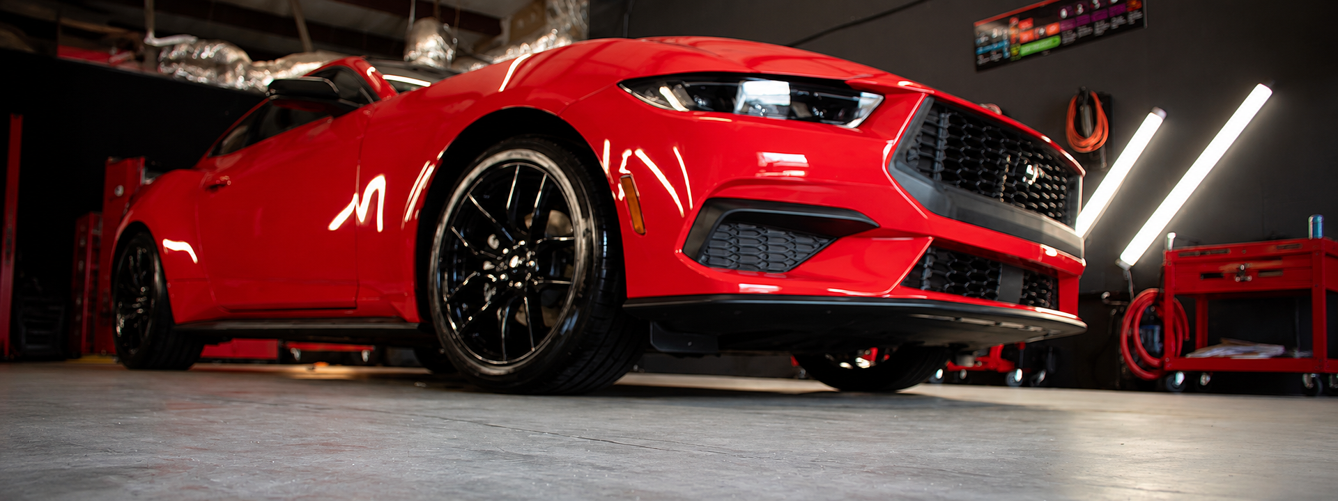 Red Ford Mustang receiving professional ceramic coating and auto detailing service at Shine Again Auto Detailing in Newnan, GA