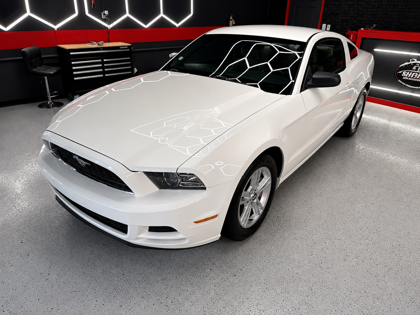 Detailed white Ford Mustang showing a glossy paint finish after exterior auto detailing in Newnan GA