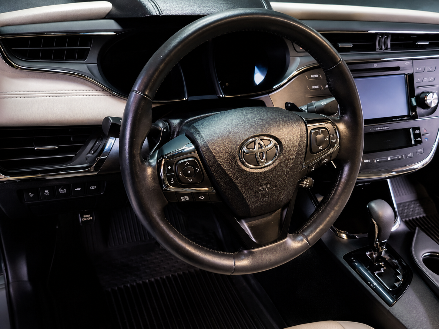 Detailed Toyota steering wheel and clean dashboard showcasing professional interior detailing in Newnan, GA.