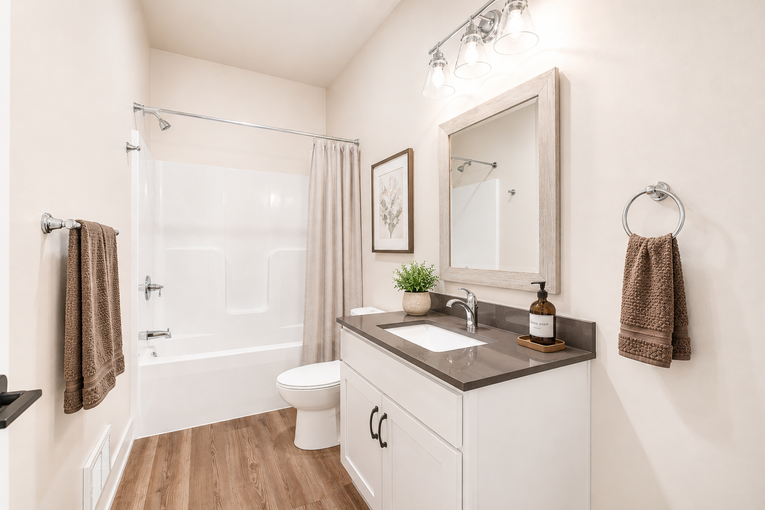 Updated bathroom with modern vanity at Bradford Station Apartments
