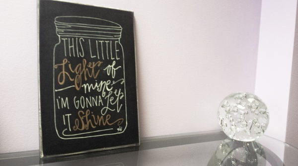 inspirtional poster and crystal in office for Light of Mine, providing healing through intuitive and medium readings