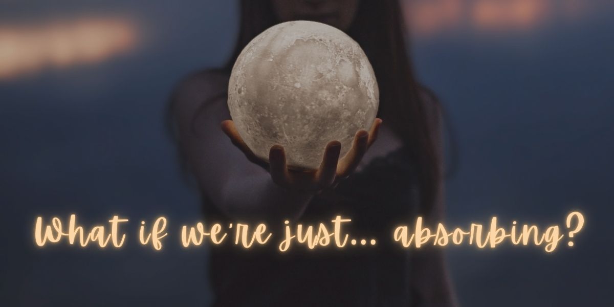 Woman holding a glowing orb, with text 