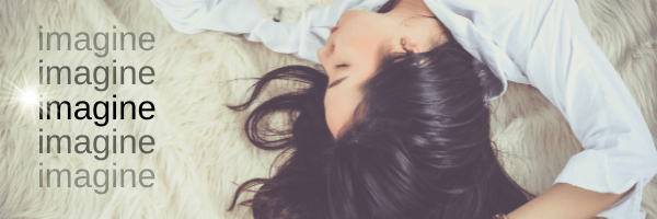 A woman with brown heair lying on a bed and the text