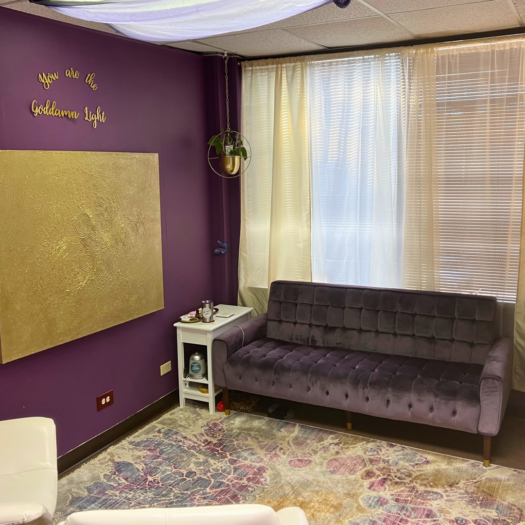 A gold and purple office for Light of Mine, an energy healing and psychic healing business in Denver