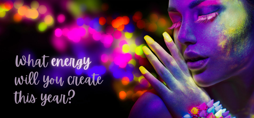 a woman with neon black light face paint glows with energy