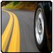 Car wheel on curved road, yellow lines. | Quality Car & Truck Repair
