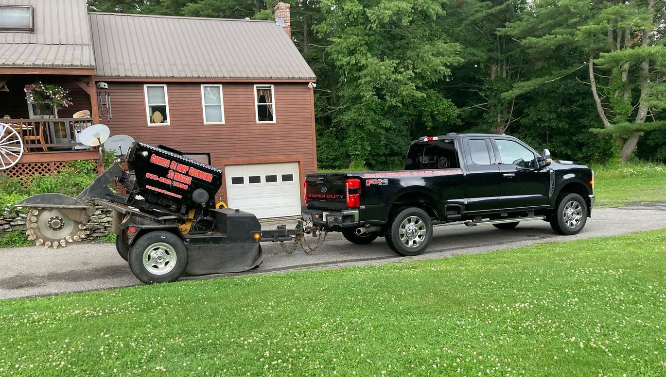 A Service Car on A Concrete | Lunenburg, MA | Curtis Stump Grinding Service