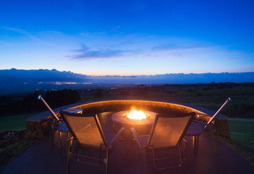 There is a fire pit in the middle of the patio.