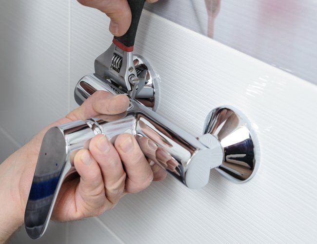 Installing Faucet — Mornington Peninsula — CB Plumbing Group Installing Faucet — Mornington Peninsula — CB Plumbing Group