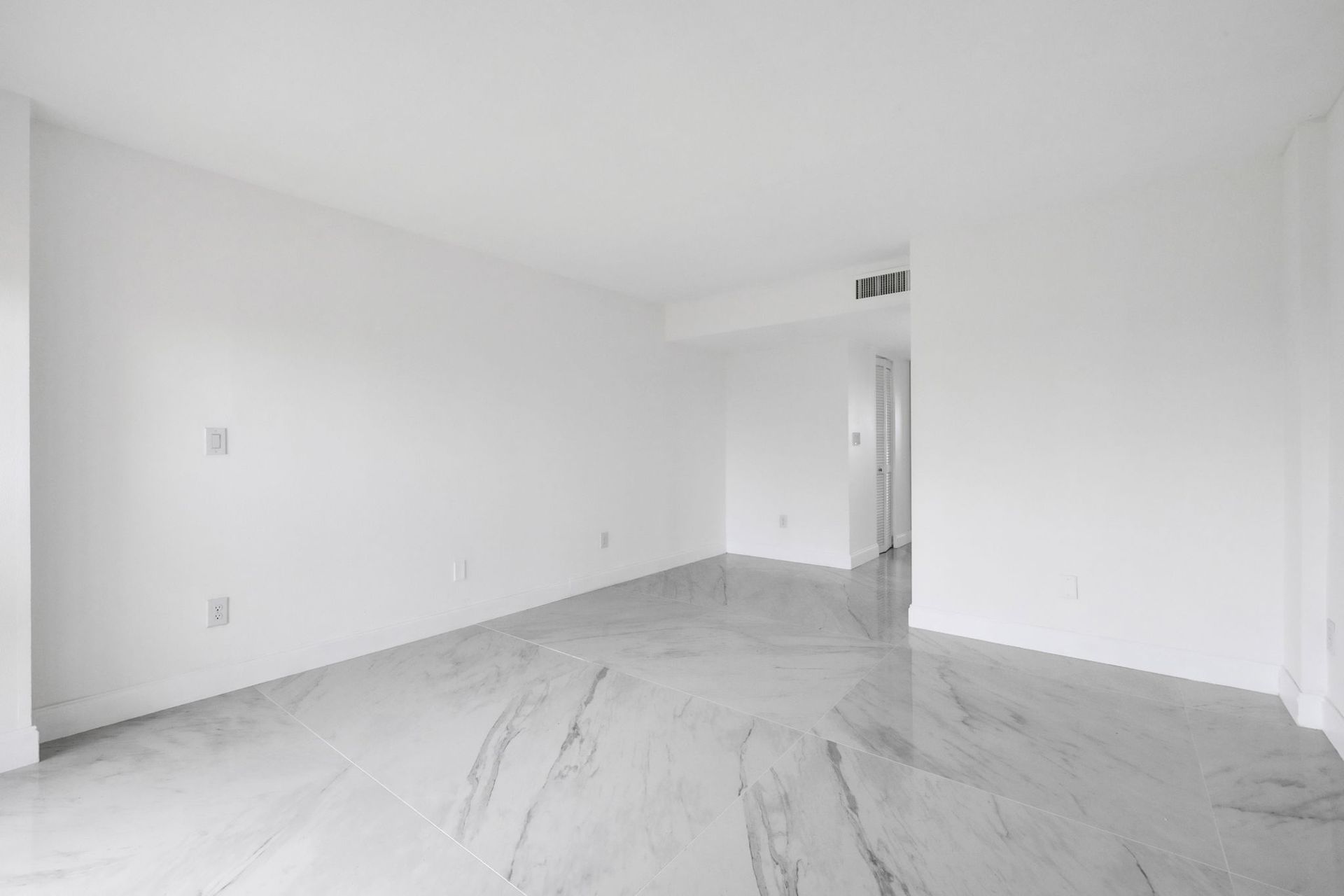 Empty white modern room with marble floor and doorway