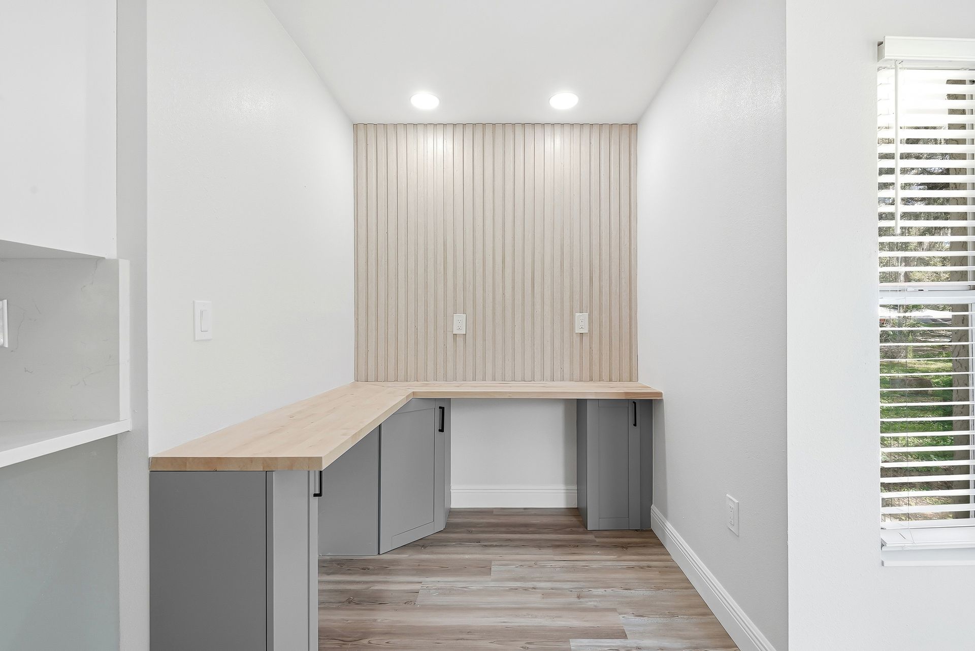 Built-in desk nook with vertical wood slat accent wall