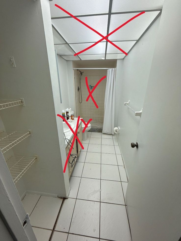 Narrow white hallway with tiled floor, shelves, and a doorway; red X marks several objects and areas.