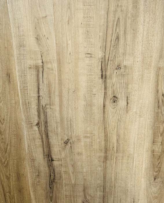 Light tan wood plank surface with visible grain and knots