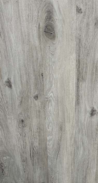 Gray weathered wood plank surface with visible knots and grain patterns