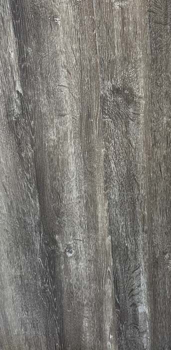 Gray wood-grain textured surface with vertical streaks
