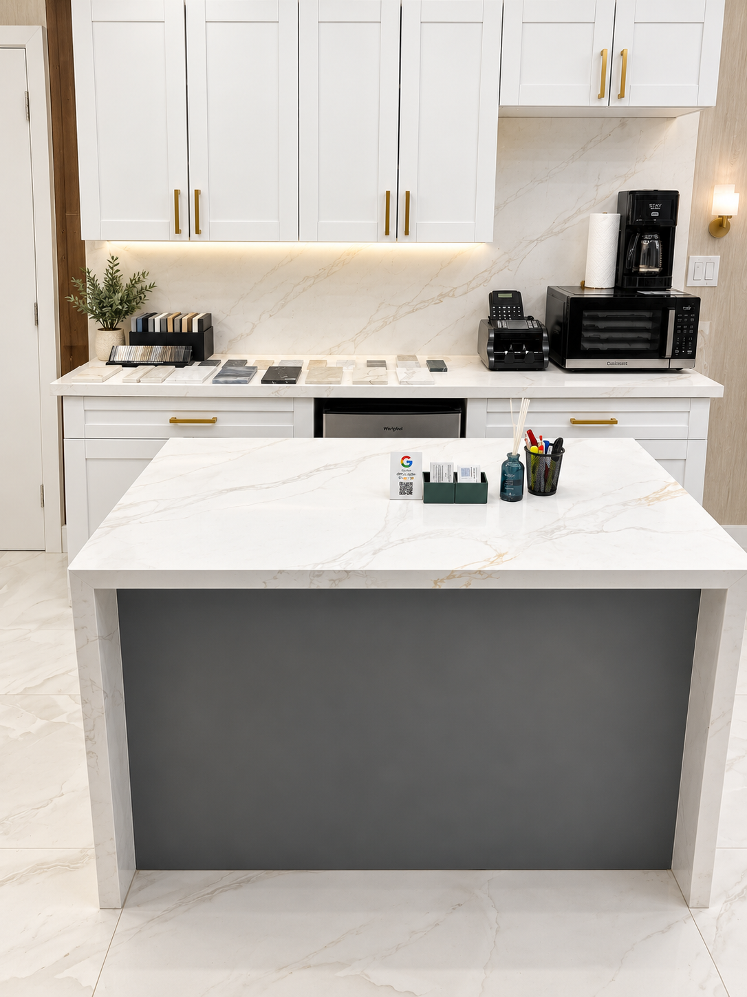 Waterfall countertop island and cabinetry display at Fort Lauderdale showroom