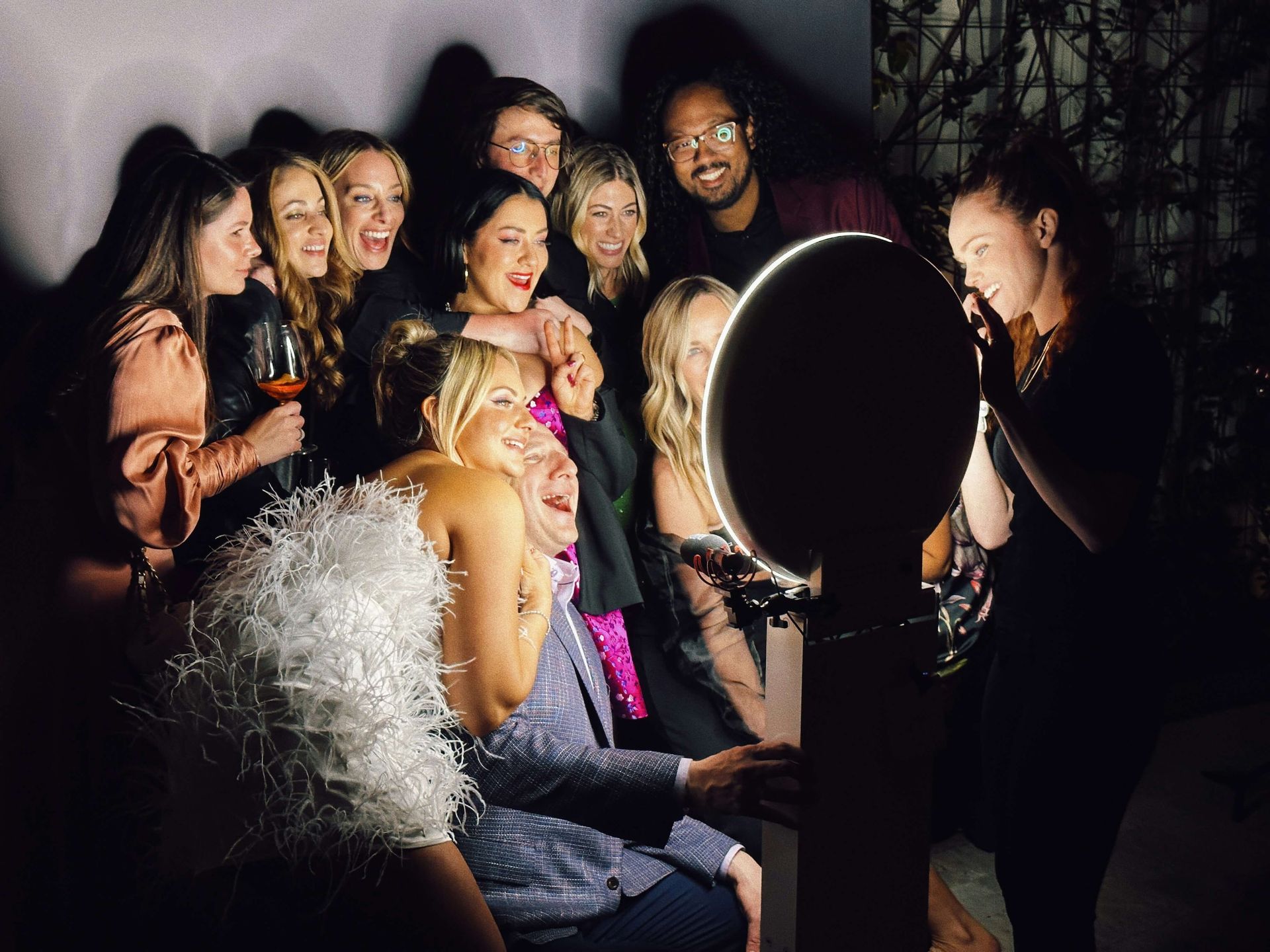 Roaming photographer capturing a group of friends at a party