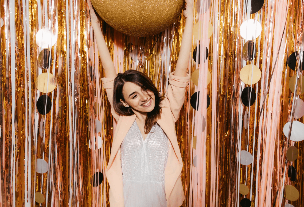 Woman posing for digital photo booth with customized background