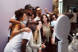 Friends using the classic photo booth at an informal party