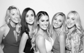 Five women using the Glam photo booth rental to keep a edited picture of the wedding