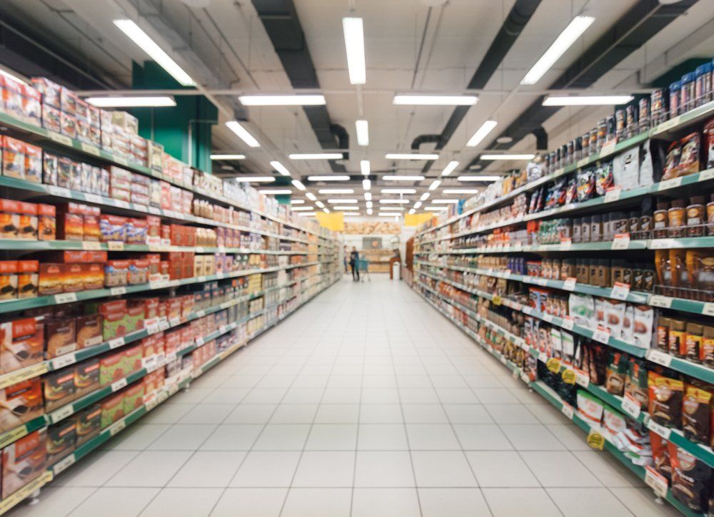 Supermarket Aisle With Colorful Shelves — Grocery Store in Mid North Coast, NSW
