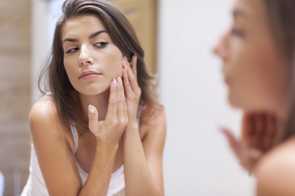 Woman Taking Care of Her Skin — Skincare & Beauty Products in Mid North Coast, NSW