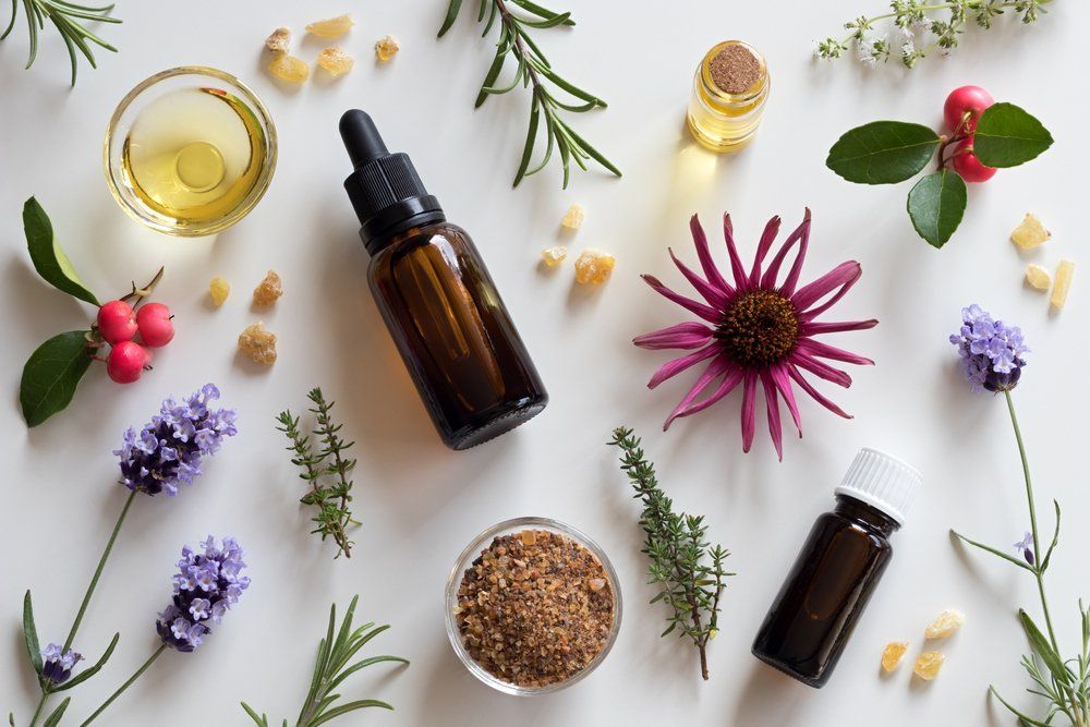 Bottles of Essential Oil With Rosemary — Essential Oils in Mid North Coast, NSW