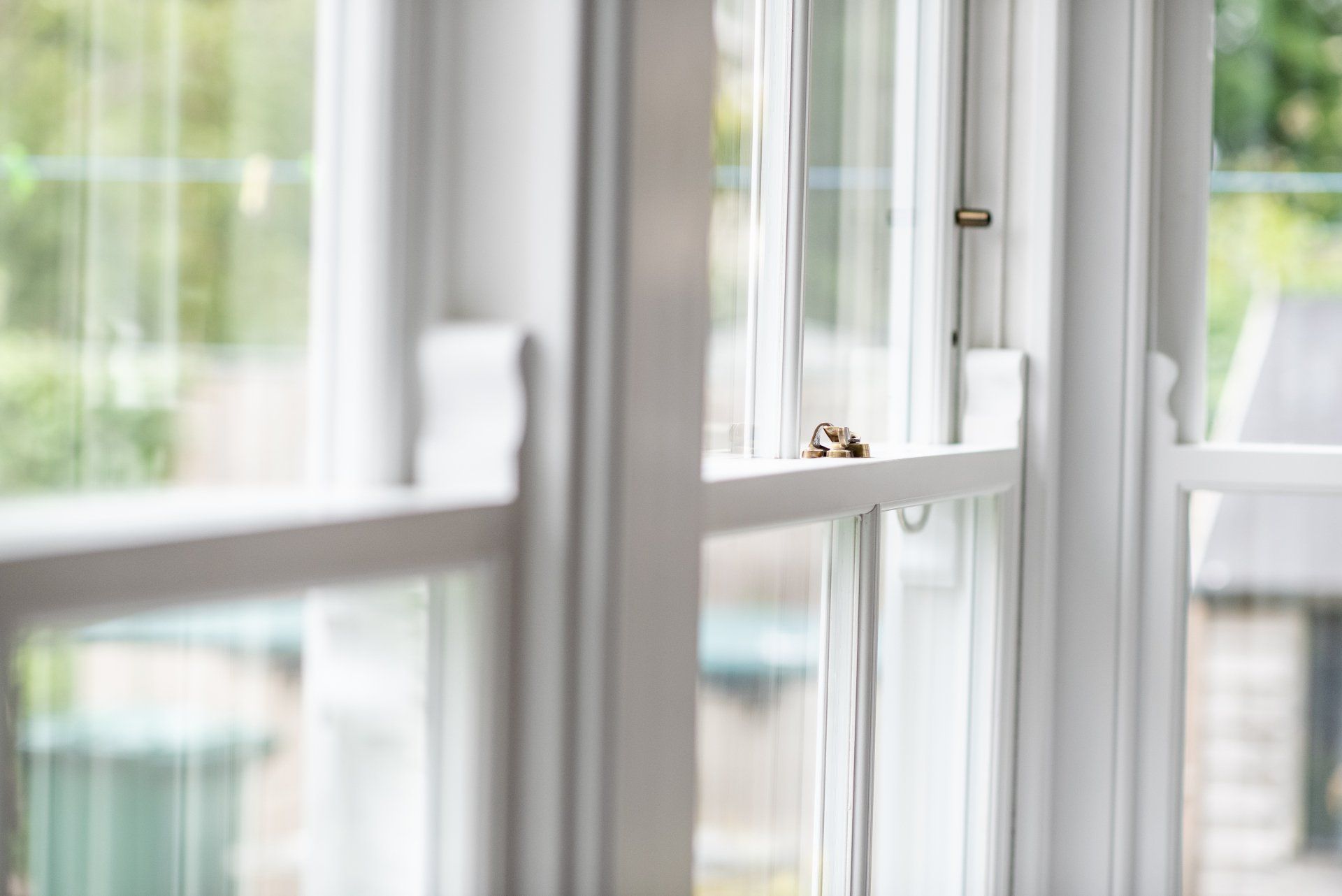 Bright and airy close up image of sash windows
