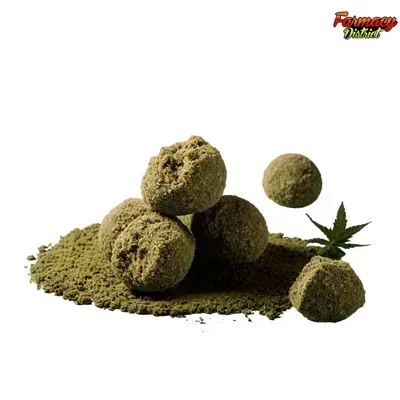 Green cannabis buds on a pile with a small leaf on white background