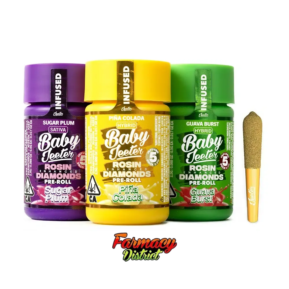 Three Baby Jeeter's jars in purple, yellow, and green with a gold pre-roll beside them on white background