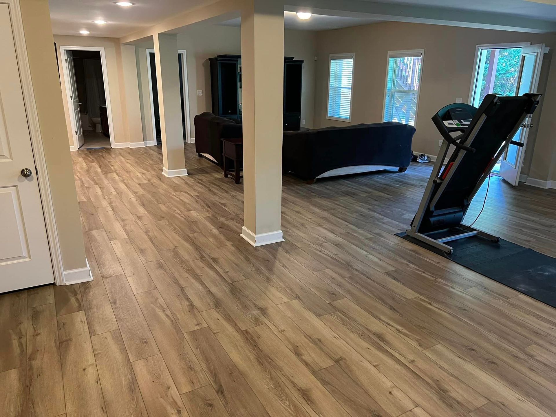 there is a treadmill in the middle of the room .