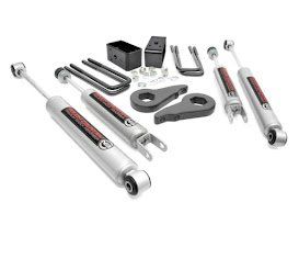 Assorted silver and black automotive suspension and steering parts laid out on a white background