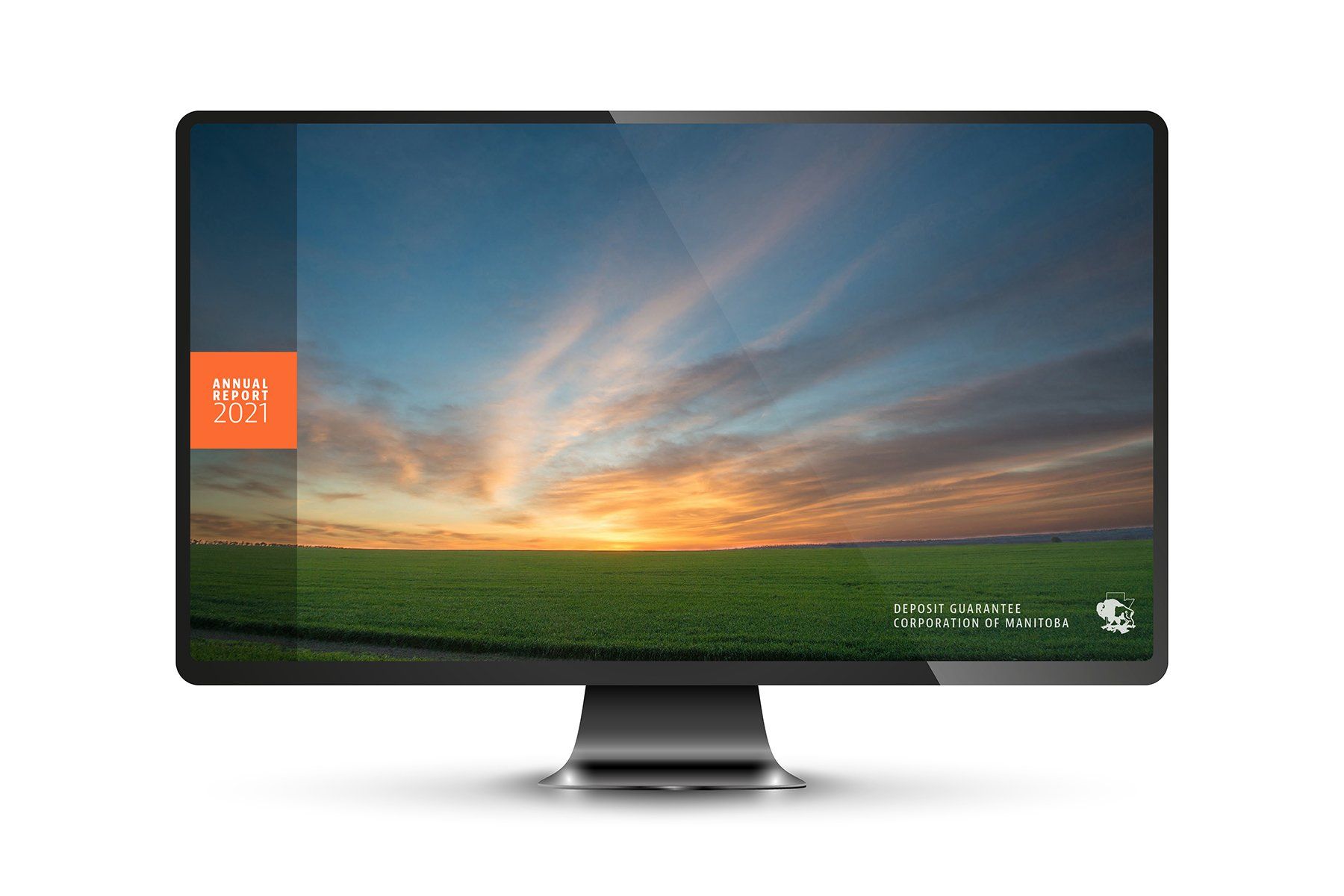 Computer screen displaying a sunset over a green field with a logo in the top left.