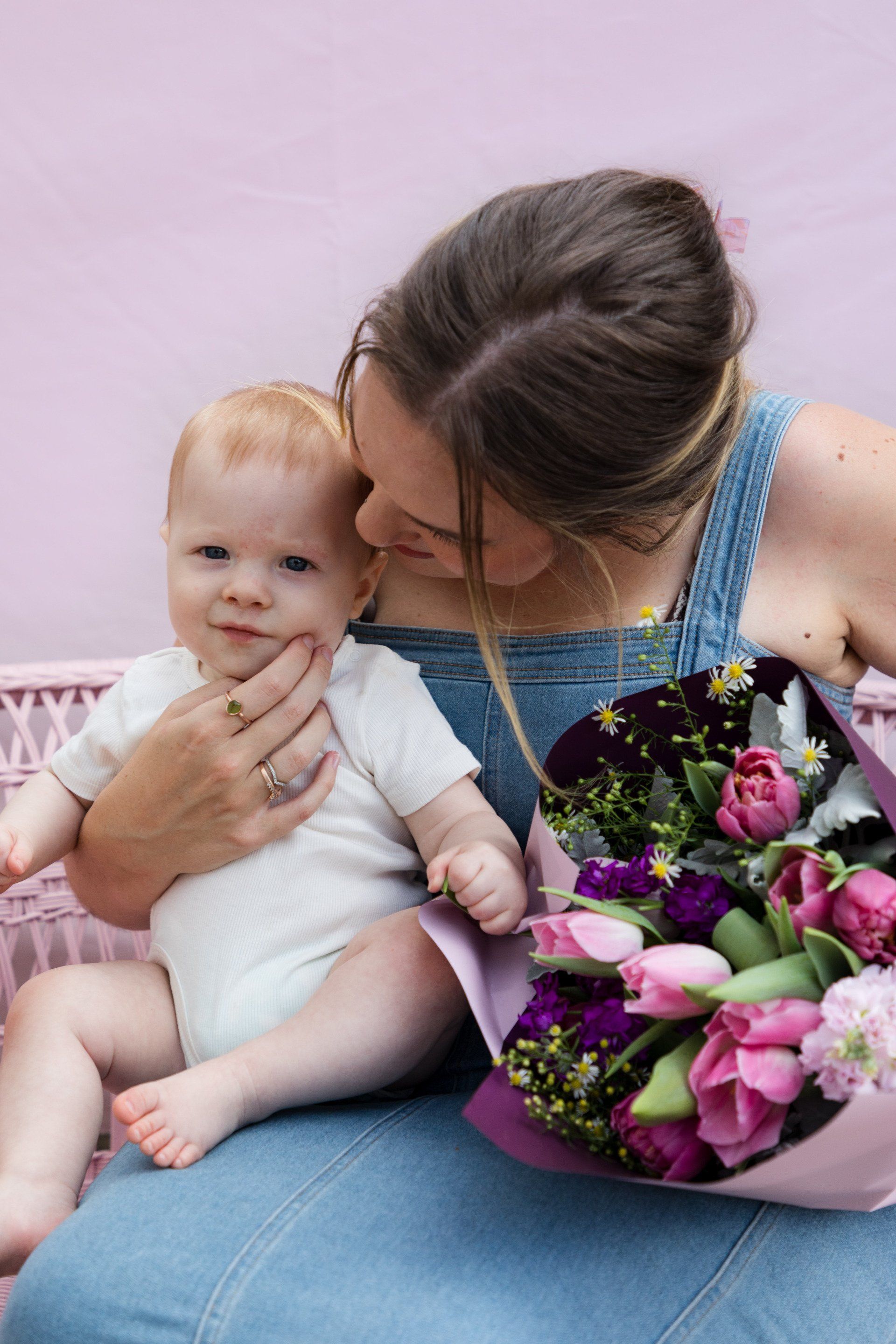 Heartwarming Mums with her newborn, symbolizing new beginnings and the joy of family, complemented by Darwin's floral delivery service.