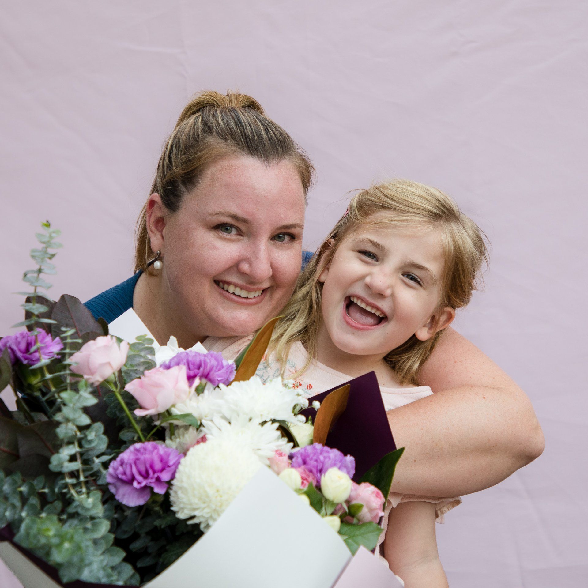 Second family snapshot, showcasing laughter and unity, enhanced by Darwin's floral beauty.