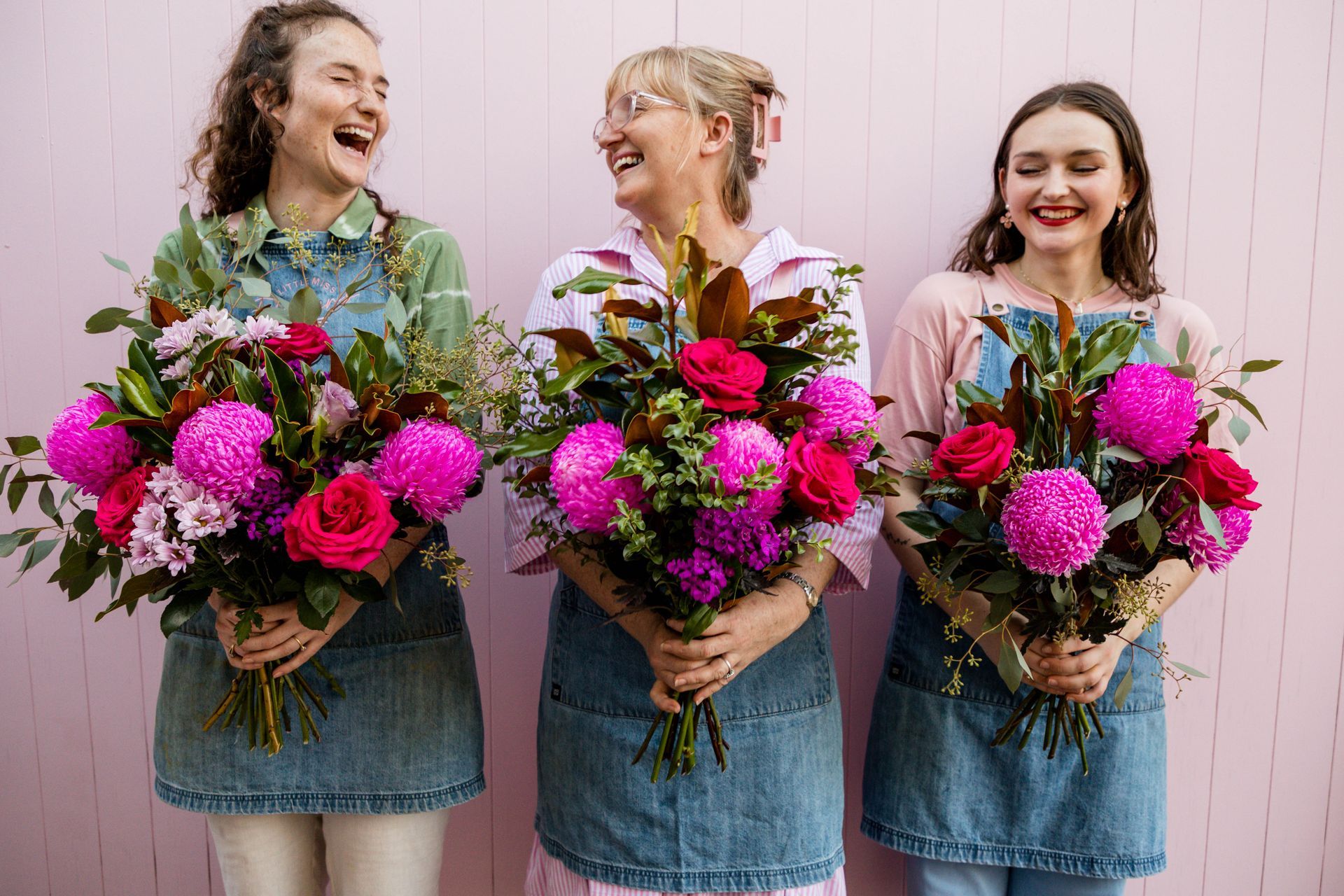 Florist arranging a vibrant bouquet with fresh flowers in Darwin, NT.
