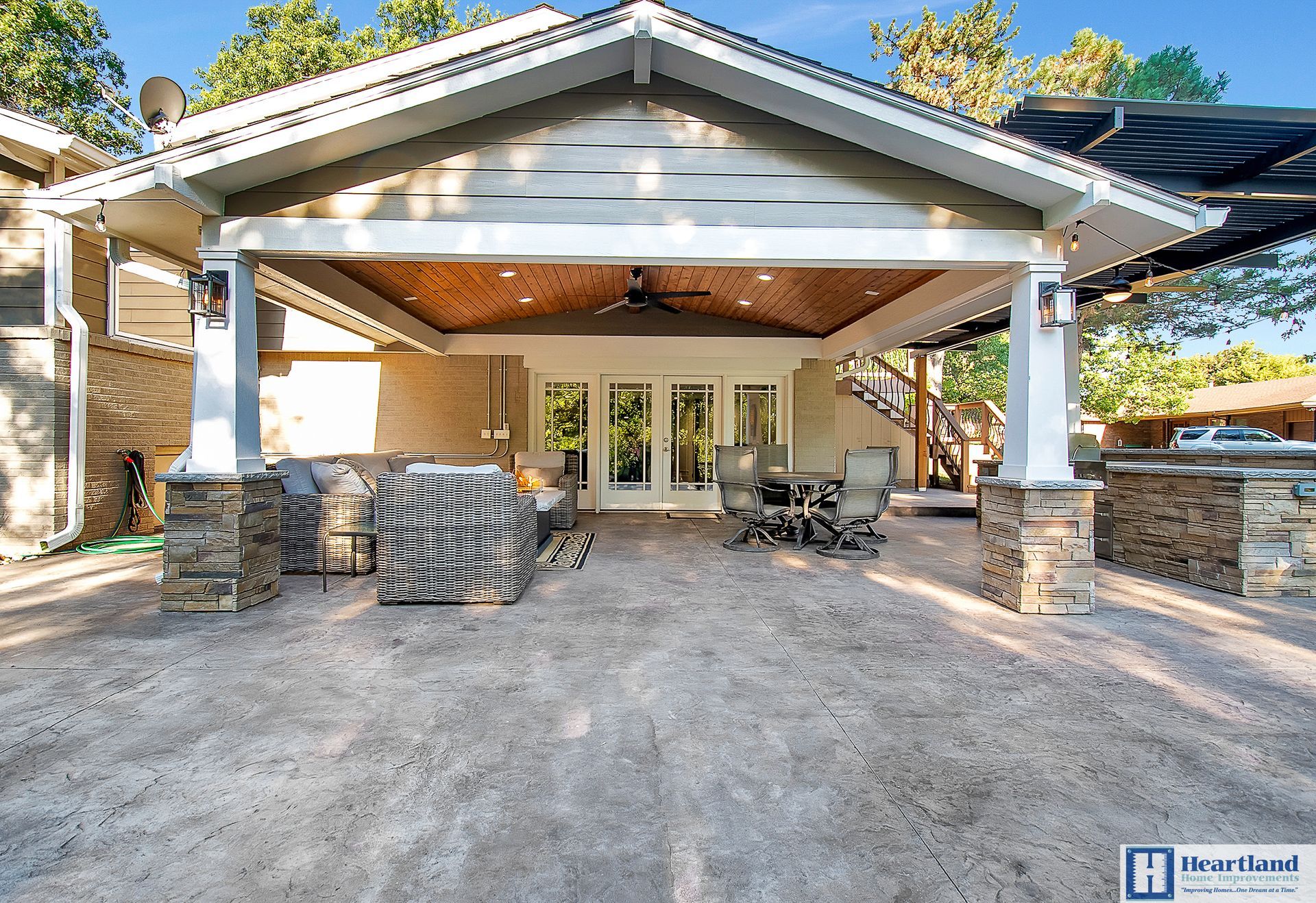 A house with a covered patio and a ceiling fan