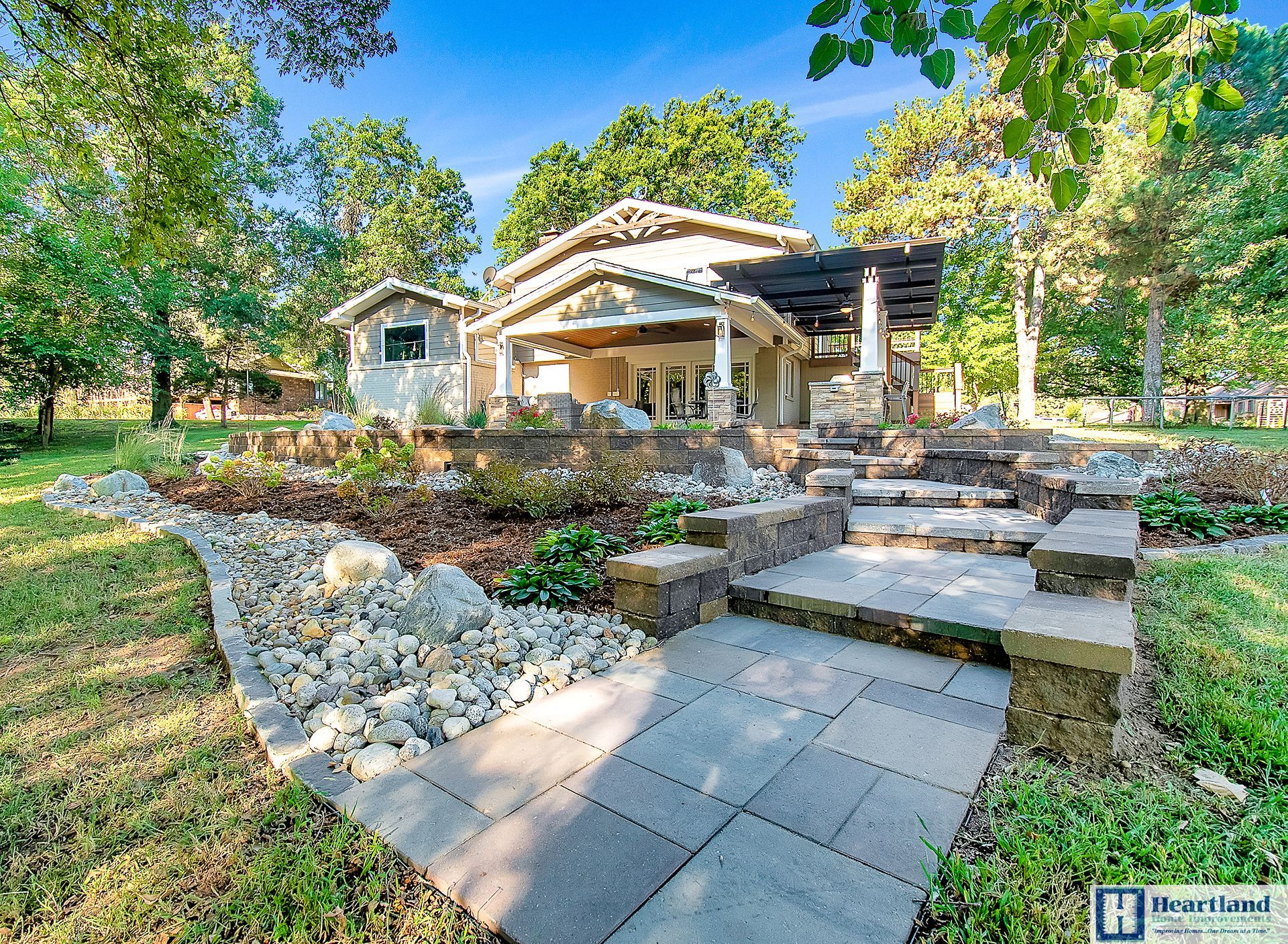 A house with a stone walkway leading to it