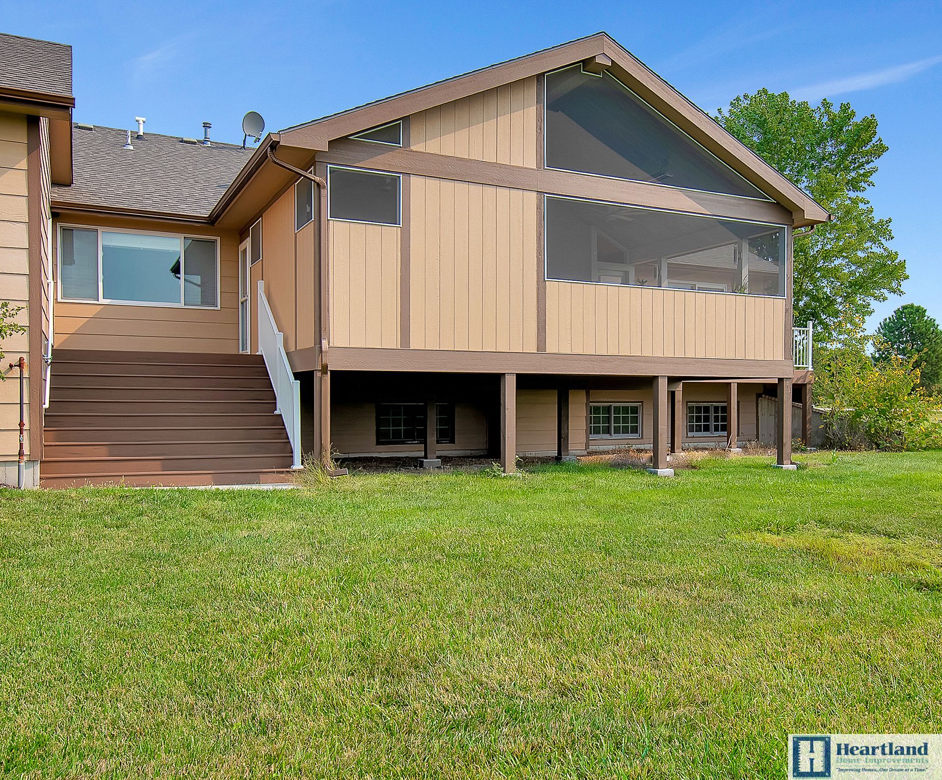 A house with a screened in porch is for sale