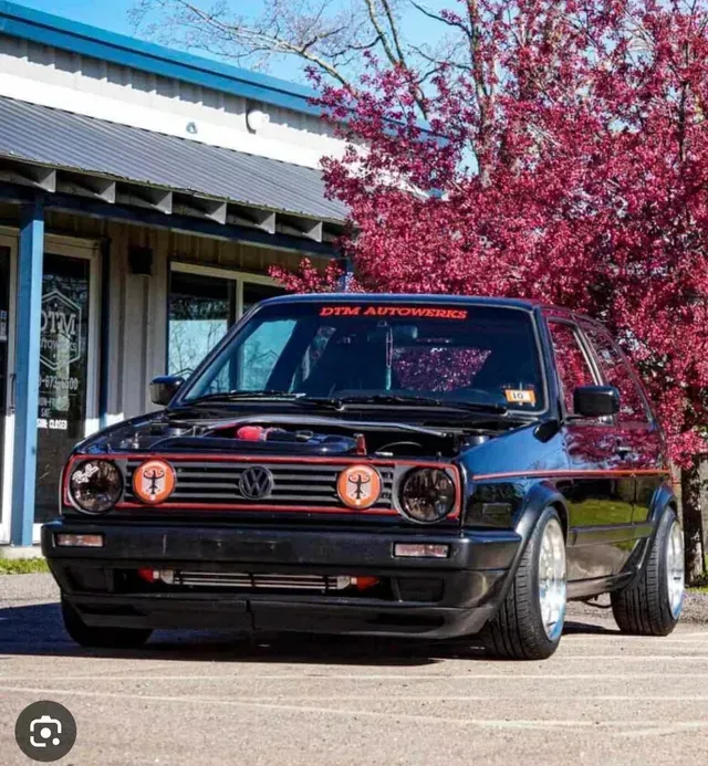 Black Volkswagen Hatchback with Orange Lights | DTM Autowerks