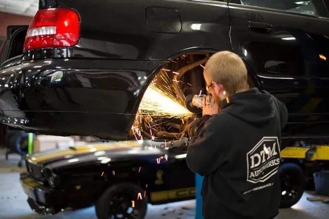 Technician Performing Custom Fabrication Work On A Lifted Vehicle | DTM Autowerks