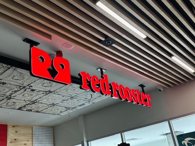 A Large Building With A Lot Of Windows And Doors — Northern Territory Sign Services in Winnellie, NT