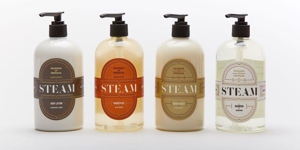 Four bottles of steam soap are lined up in a row
