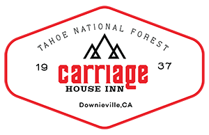 A logo for carriage house inn in tahoe national forest